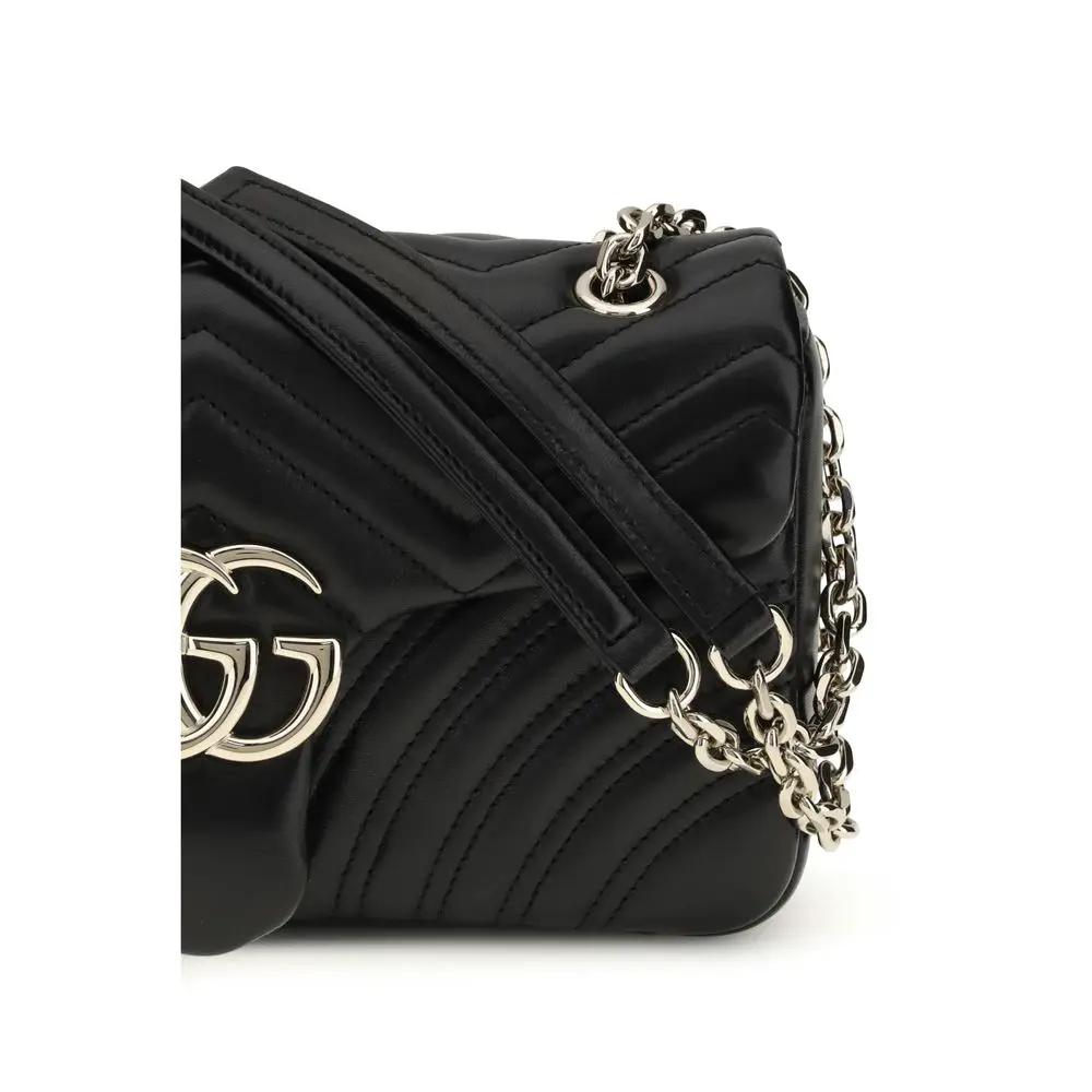 Gucci GG Marmont medium shoulder bag, black quilted leather with gold chain, side view