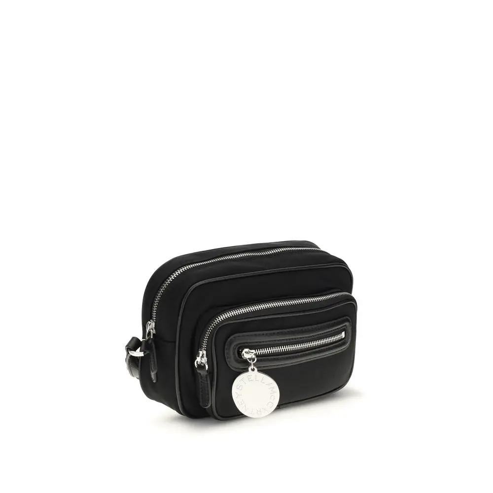 Stella McCartney black polyamide shoulder bag with front zip pocket and circular logo charm, front view