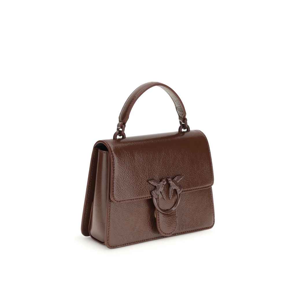 PINKO Burgundy goatskin handbag, top-handle bag with ring-bow detail, front view