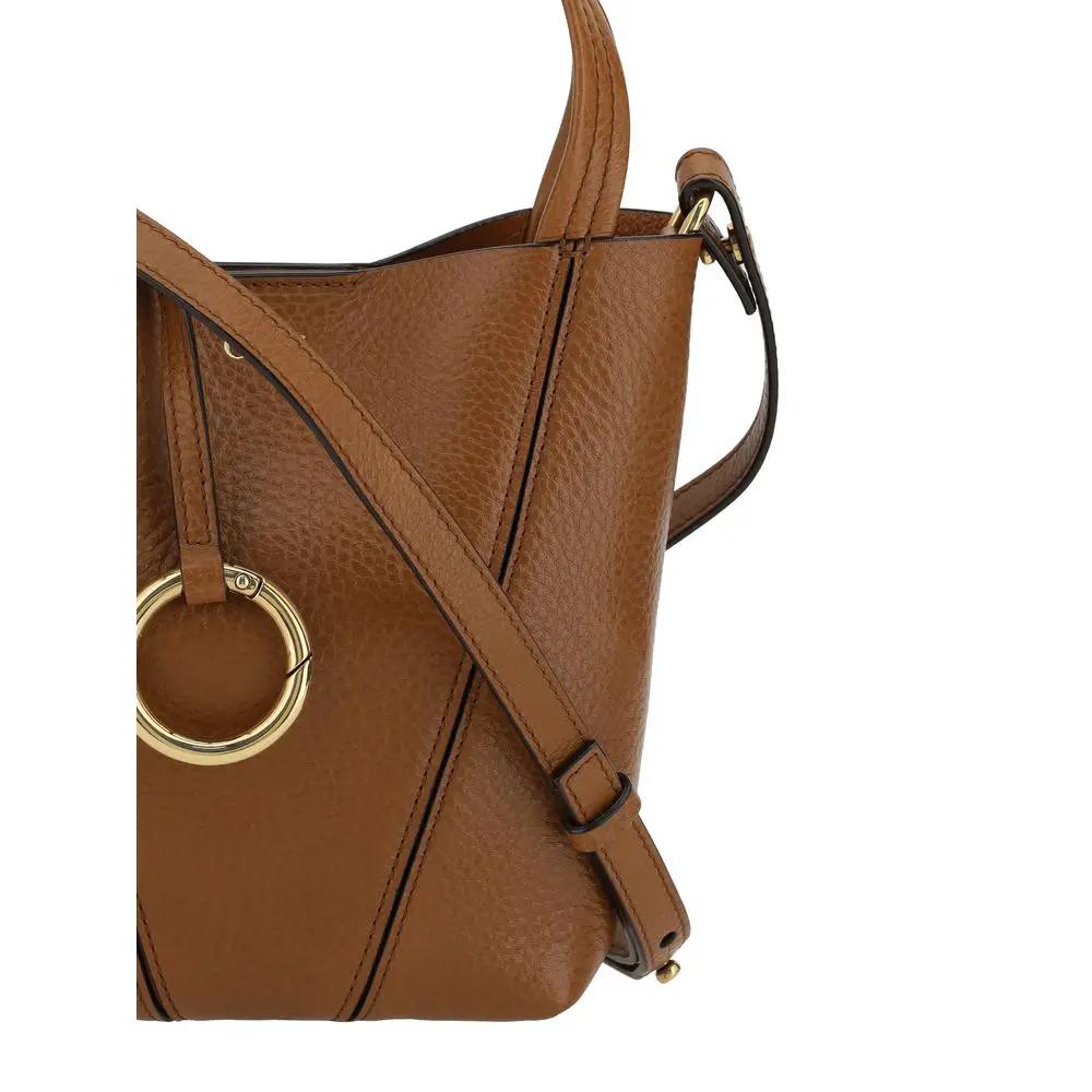 Chloé Spin Mini Shoulder Bag in brown pebbled leather with gold ring detail, side view