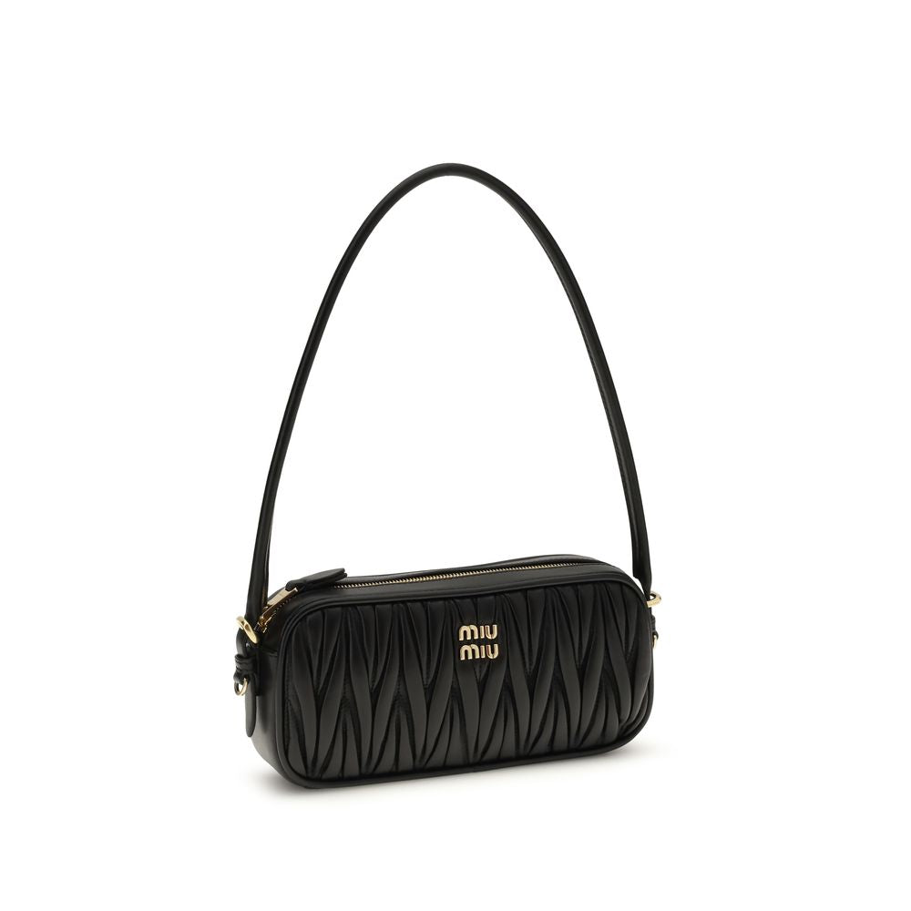 Miu Miu Matelassé Leather Mini Bag with gold logo hardware, zip closure, black leather and rounded top handle
