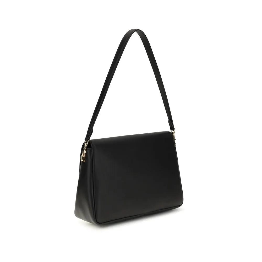 Tory Burch Bos Taurus shoulder bag black calf leather three-quarter view
