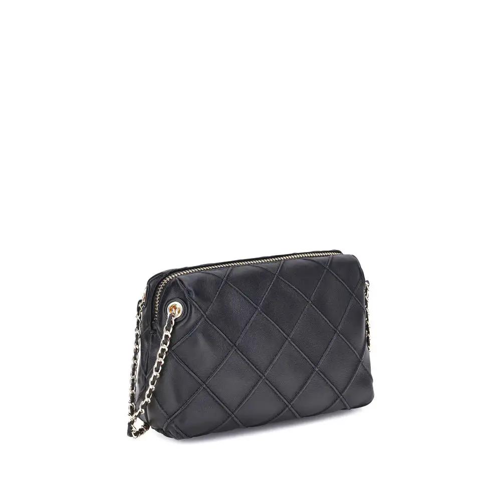 Tory Burch Fleming Shoulder Bag in black quilted leather with chain strap, side view