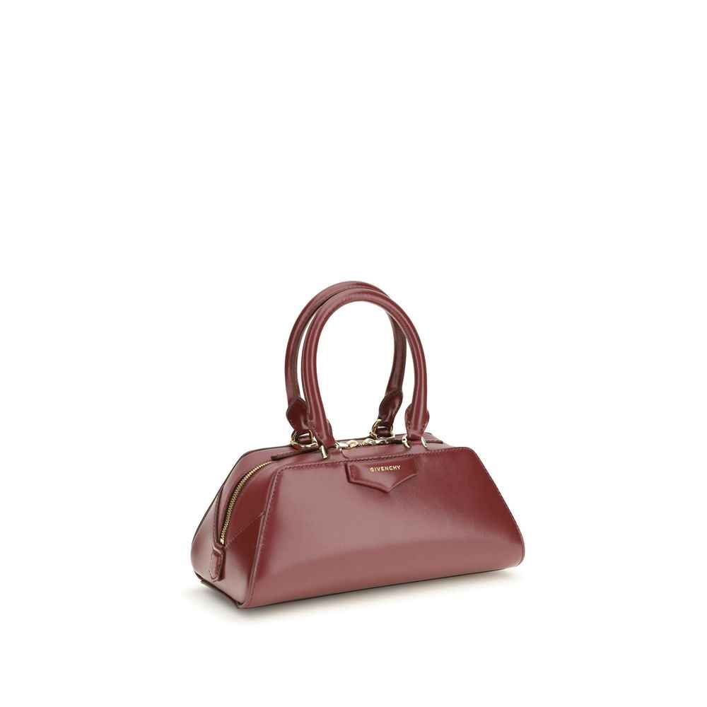 Givenchy Mini Antigona East-West handbag in burgundy calf leather, top-handle bag, three-quarter front view