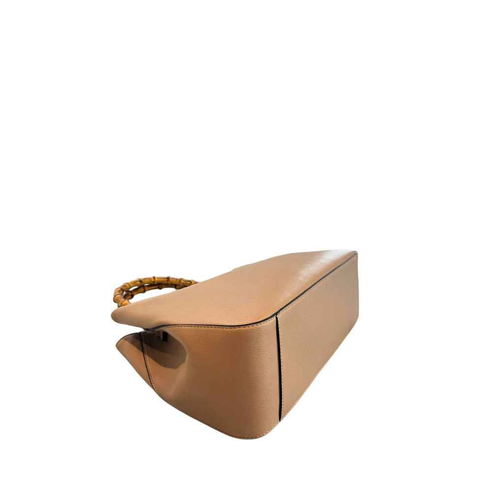 Twinset brown PU handbag, side-angled three-quarter front view