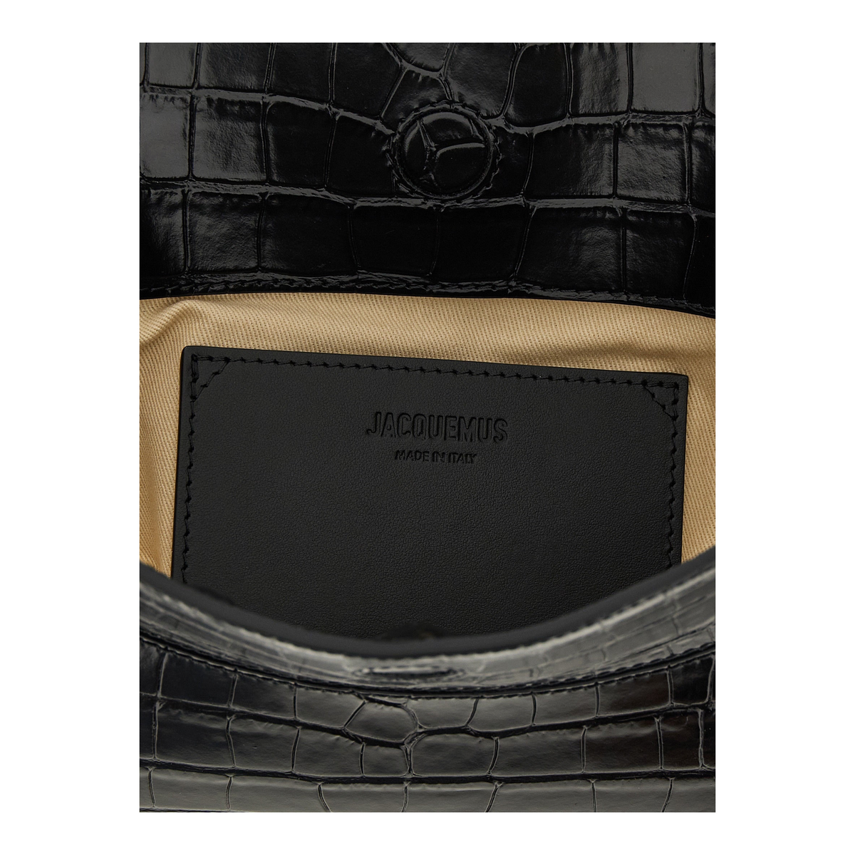 Interior de bolso XT & Co Jacquemus La Pochette Ovalo en piel negra efecto cocodrilo con forro de algodón beige.