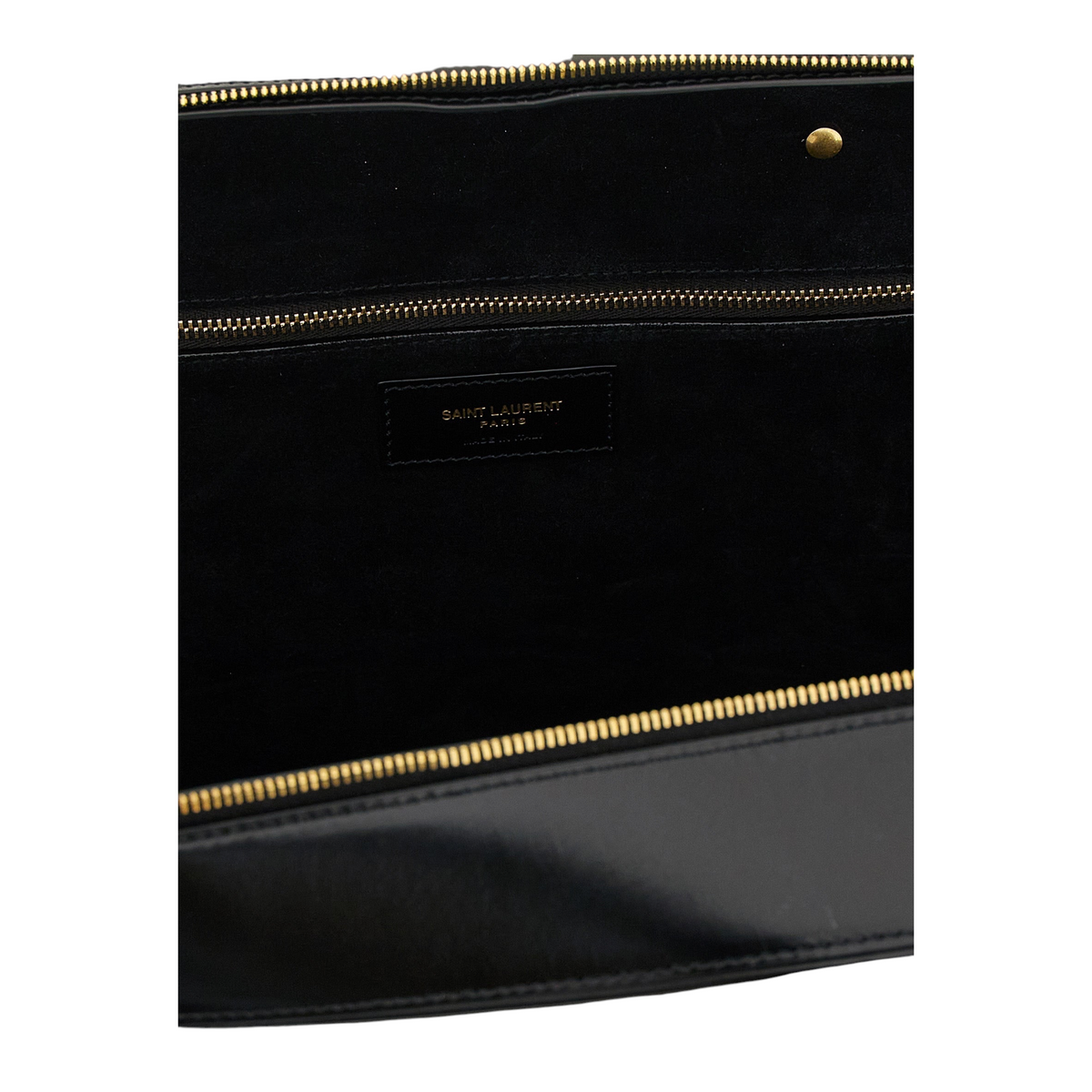 Interior del bolso XT & Co Sac De Jour de Saint Laurent en piel negra con cremallera dorada y logo grabado