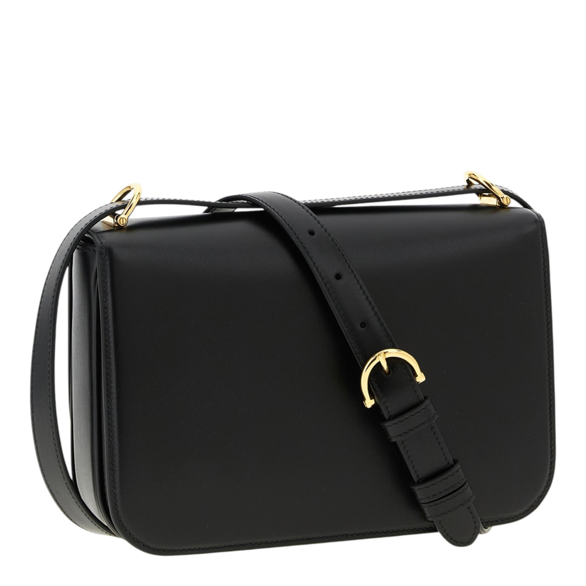 Bolso bandolera Siena de XT & Co en piel de becerro negra con detalle de medio horsebit metálico y correa ajustable.