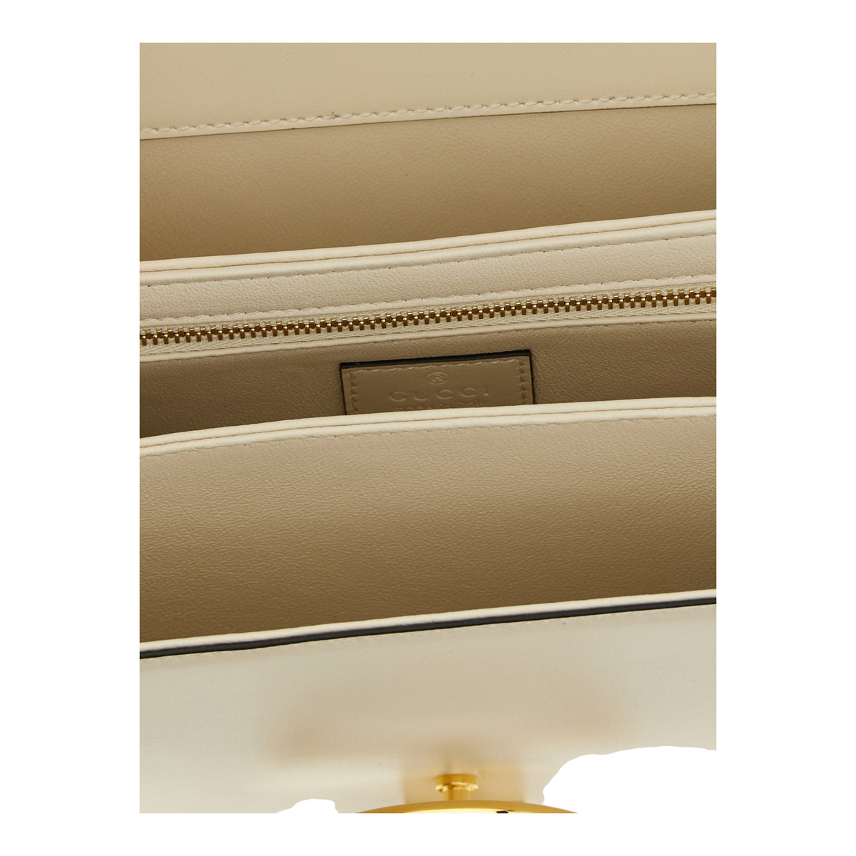 Interior del bolso bandolera Siena de XT & Co en piel de becerro blanca con compartimentos y cremallera