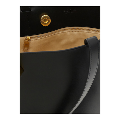 Interior de bolso XT & Co Le Bambola Moyen en piel negra con forro beige, cremallera dorada y cierre de anilla