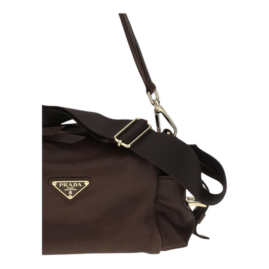 Bolso de hombro Prada Explore de piel nappa marrón con correa ajustable y logo triangular de XT & Co
