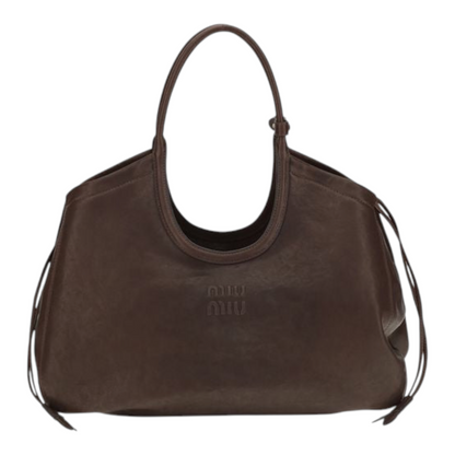 Bolso tote Ivy de Miu Miu en piel nappa marrón con efecto envejecido, cordones laterales y herrajes dorados XT & Co