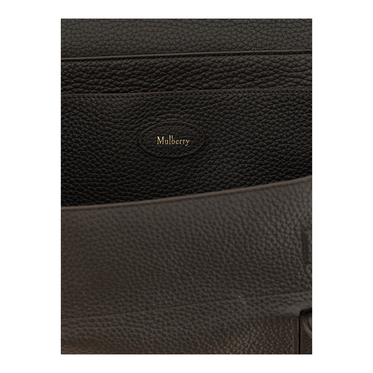 Detalle del interior del bolso Mulberry Black Soft Bayswater de XT & Co con logo dorado en piel granulada negra