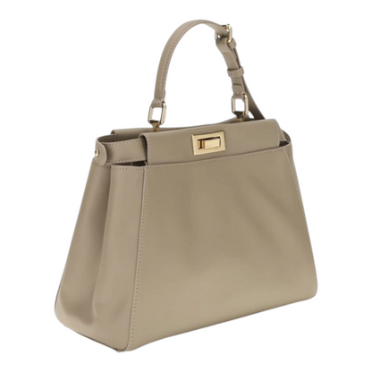 Bolso XT & Co My Peekaboo pequeño en piel beige con cierre de giro y herrajes dorados, vista lateral.