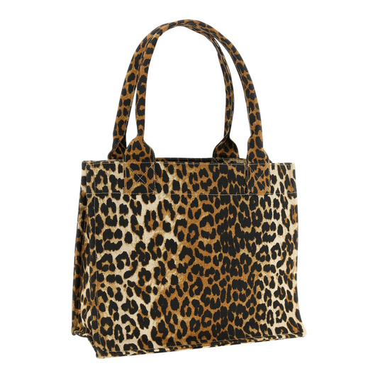 Bolso tote XT & Co Ganni de algodón reciclado con estampado de leopardo en tonos marrón y negro y asas superiores.