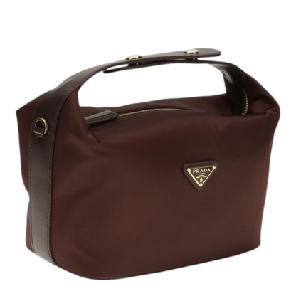 Bolso mini Chérie de XT & Co en Re-Nylon color burdeos con detalles de cuero y logo triangular esmaltado