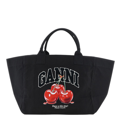 Black tote bag with 'Ganni' branding and cherry design on a white background