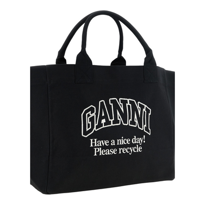 Bolso shopper XXL XT & Co de lona de algodón reciclado negro con logo Ganni blanco y mensaje de reciclaje