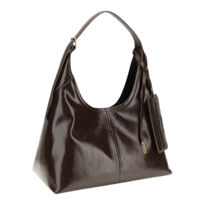 Bolso de hombro XT & Co The Belted Sack en piel marrón brillante con correa ajustable y etiqueta de equipaje grande