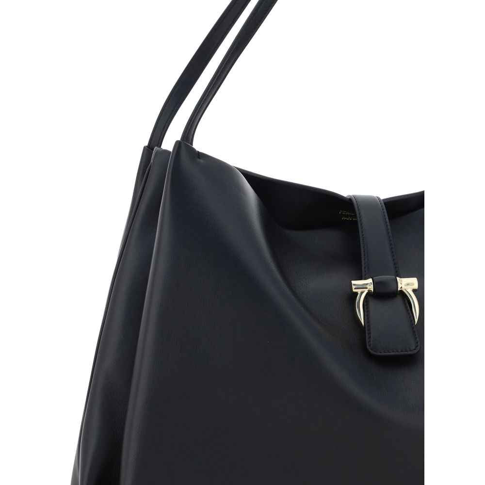 Ferragamo Black Grained Leather Tote Bag; black grained leather tote; hardware close-up view.