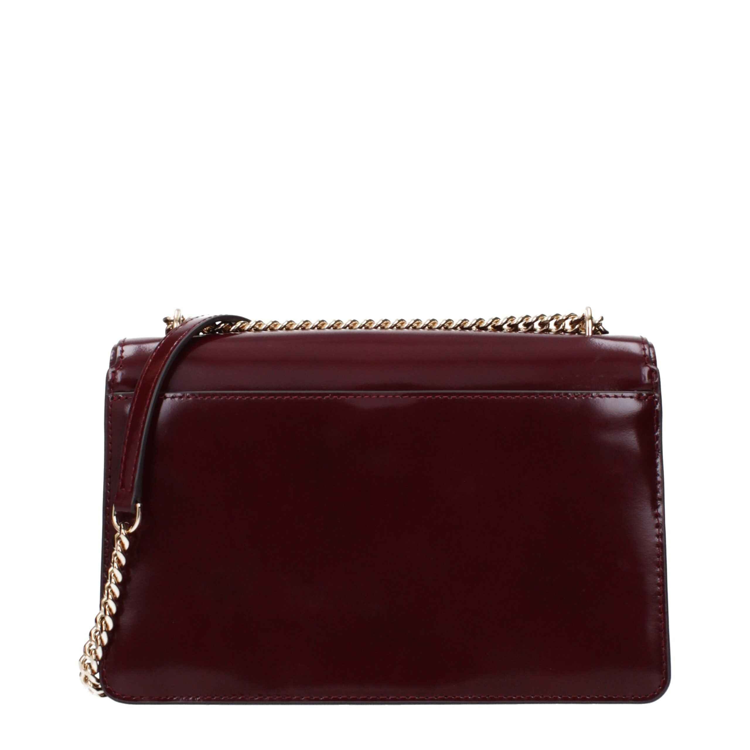 Tory Burch burgundy leather crossbody bag with gold chain strap, side view