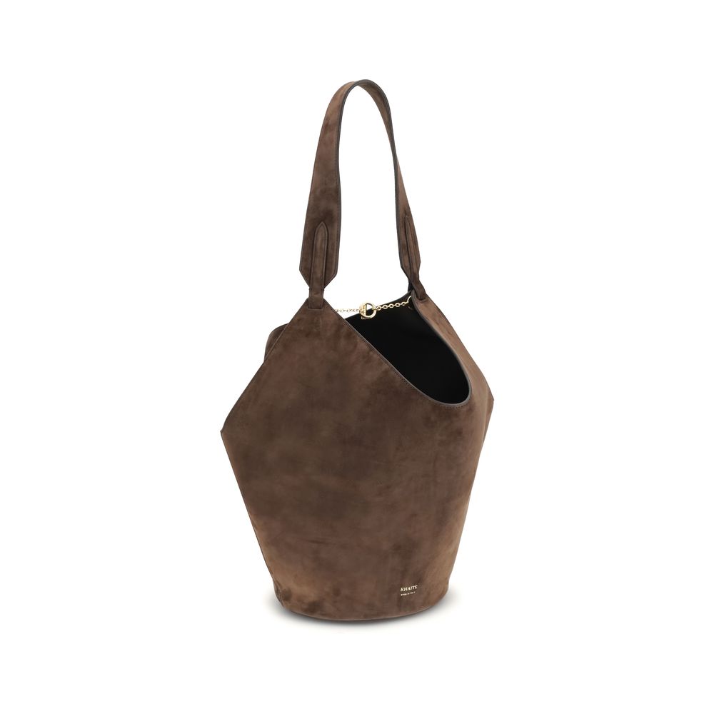 Khaite Lotus Small Suede brown shoulder bag, suede bucket style with gold chain accent, three-quarter front view